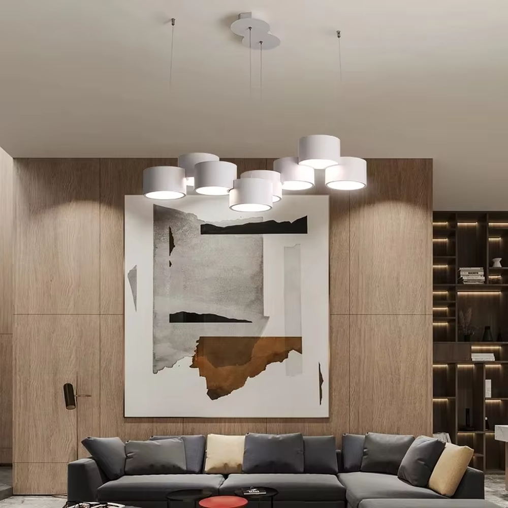 A modern minimalist multi-head cylindrical chandelier, featuring a white metal housing with a staggered stacked layout, built-in LED light source. It emits soft and uniform warm light when lit, combining decorative appeal with practical illumination, ideal for creating a minimalist and fresh space atmosphere.