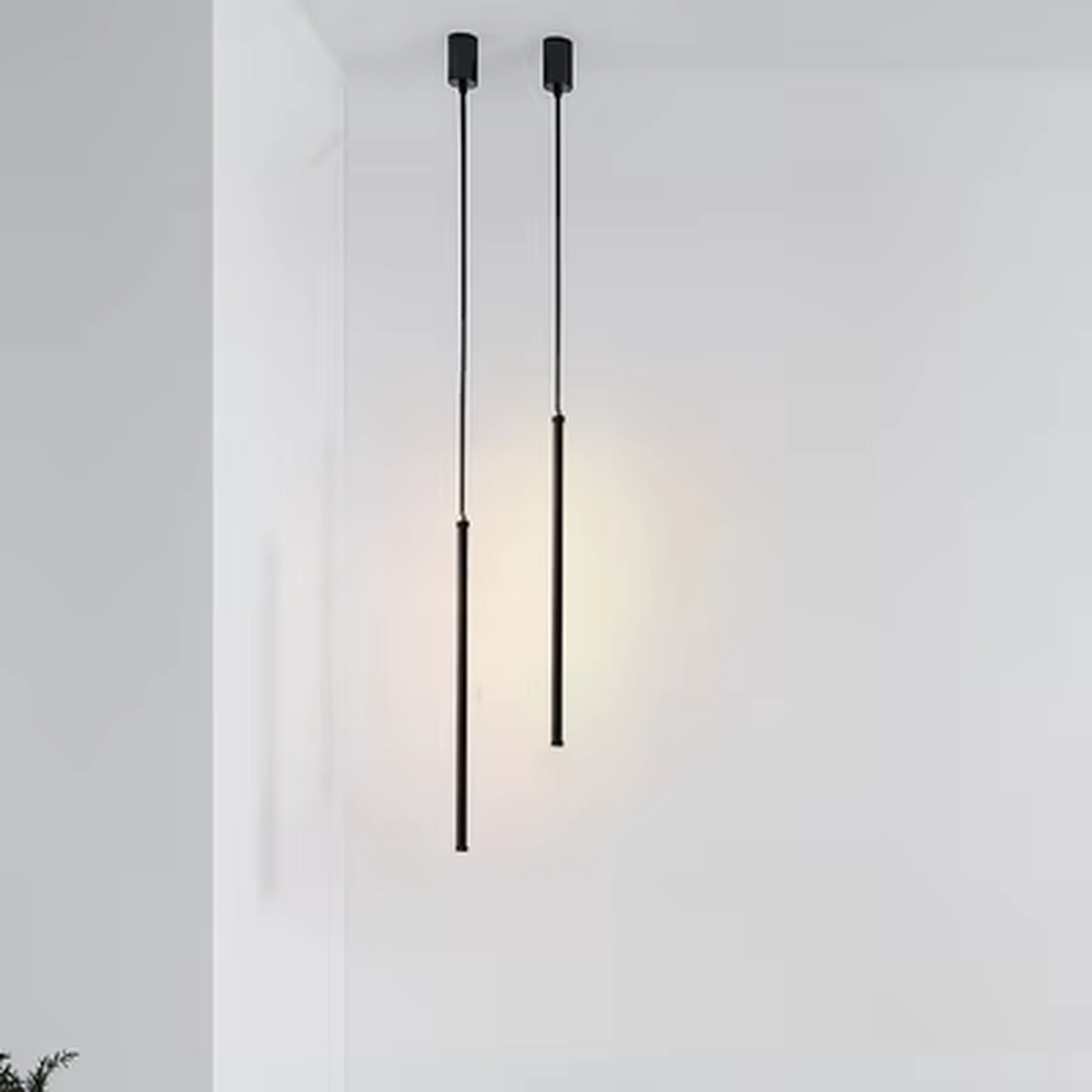 This is a modern minimalist linear pendant light, featuring a slim lamp body crafted from matte black metal, with a staggered hanging design that is simple and neat. It emits soft and uniform light, serving both lighting and decorative purposes, suitable for minimalist entrances, bedroom headboards, light luxury bars, stairwells and other scenarios.