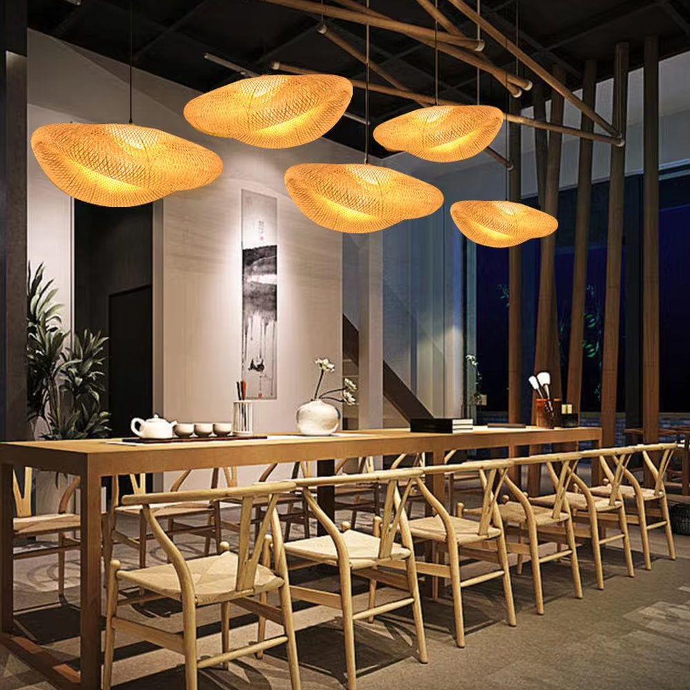 This wabi-sabi style hand-woven rattan cloud chandelier is made of natural rattan woven into an irregular UFO shape. Warm light passes through the woven texture to emit a soft and transparent halo, combining natural texture and artistic atmosphere, suitable for lighting and decoration in natural style spaces such as restaurants and tea rooms.