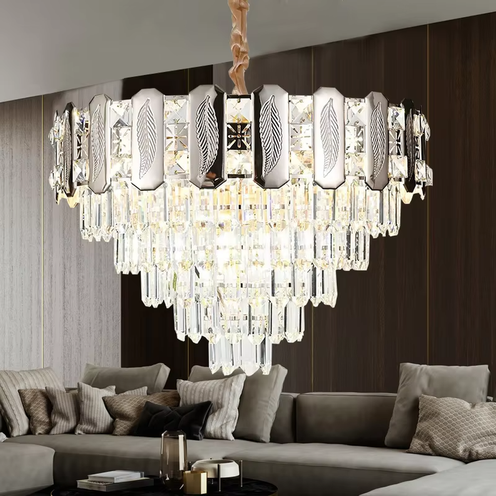 This is a light luxury cascading crystal chandelier, with a top metal frame inlaid with leaf-textured decorative panels and cut crystals, and densely cascading crystal strips hanging below, featuring brilliant and soft light, both decorative and lighting functions, ideal for high-end indoor spaces such as living rooms and dining rooms.