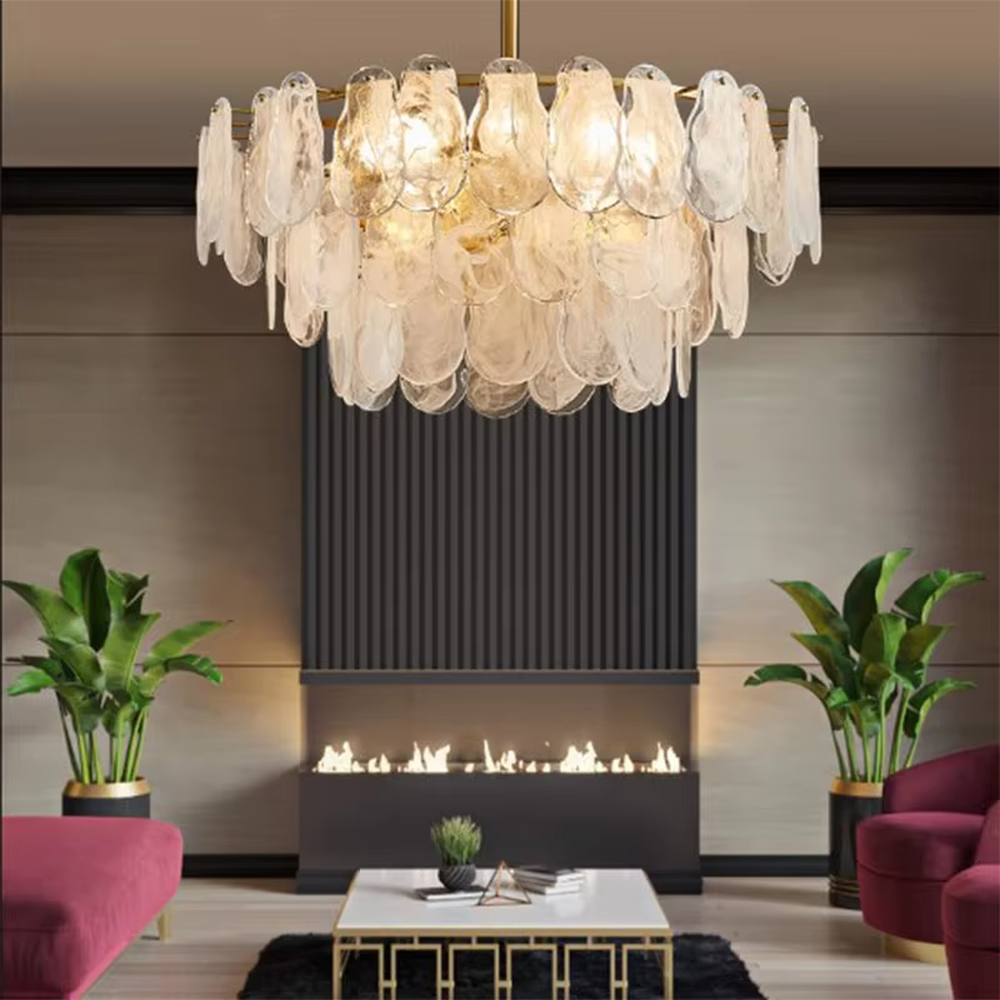 A modern light luxury style ring chandelier, featuring a gold metal frame with layered gradient glass petal panels. It emits a soft and warm glow when lit, combining decorative appeal with practical illumination, ideal for creating an elegant and sophisticated space atmosphere.