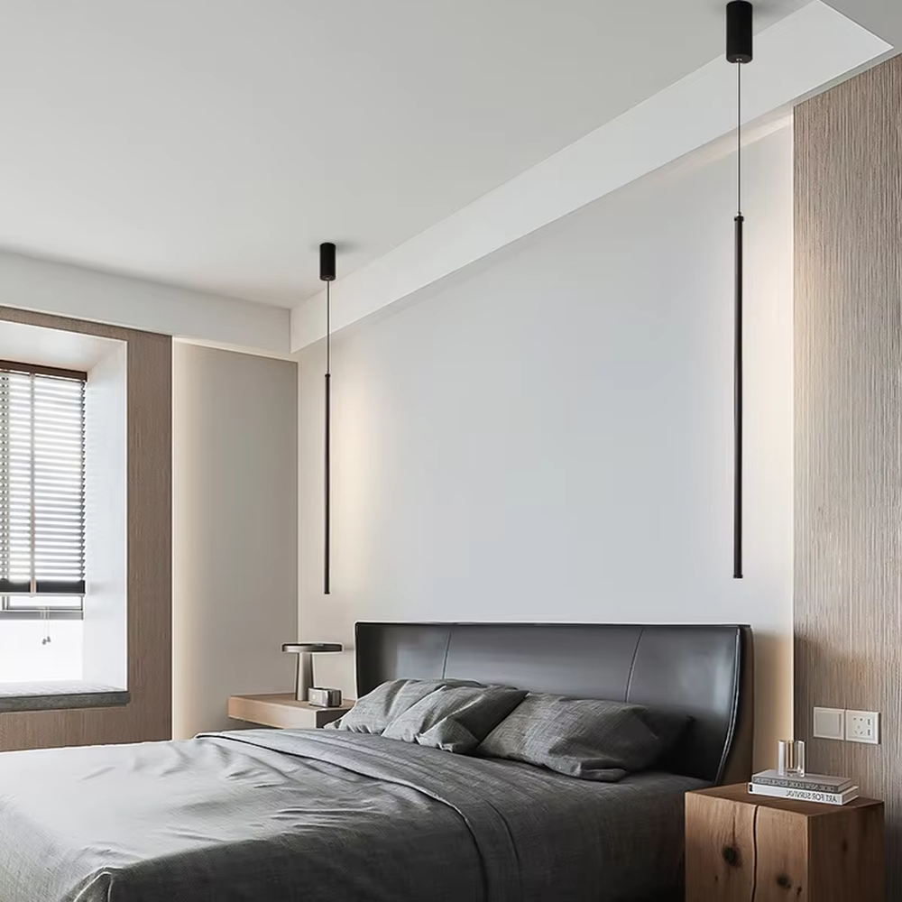 This is a modern minimalist linear pendant light, featuring a slim lamp body crafted from matte black metal, with a staggered hanging design that is simple and neat. It emits soft and uniform light, serving both lighting and decorative purposes, suitable for minimalist entrances, bedroom headboards, light luxury bars, stairwells and other scenarios.