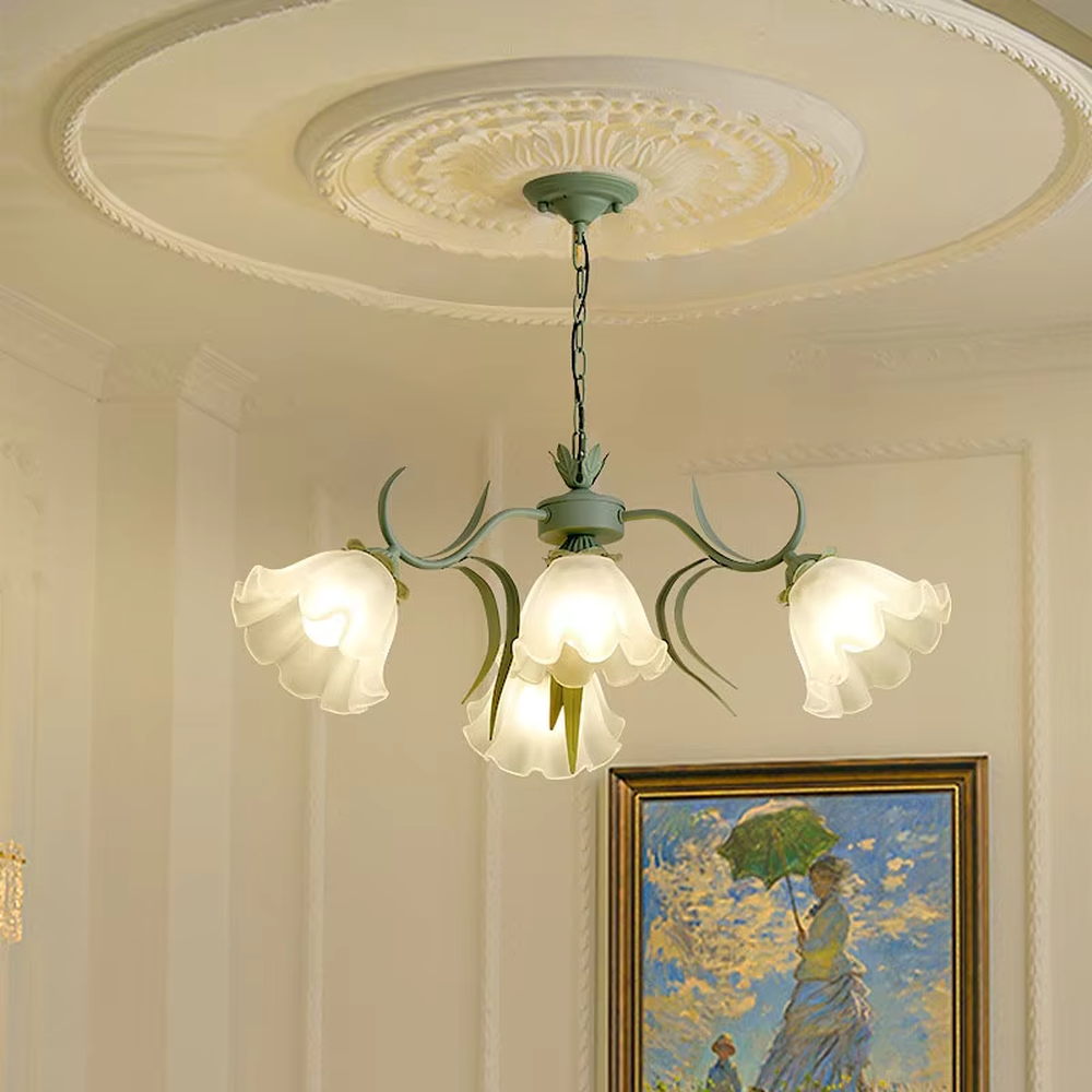 This French pastoral style flower chandelier features a green metal branch paired with white flower-shaped lampshades, with light refracting a soft halo through the frosted lampshades, serving both lighting and decorative purposes, suitable for warm and romantic spaces such as bedrooms and dining rooms.