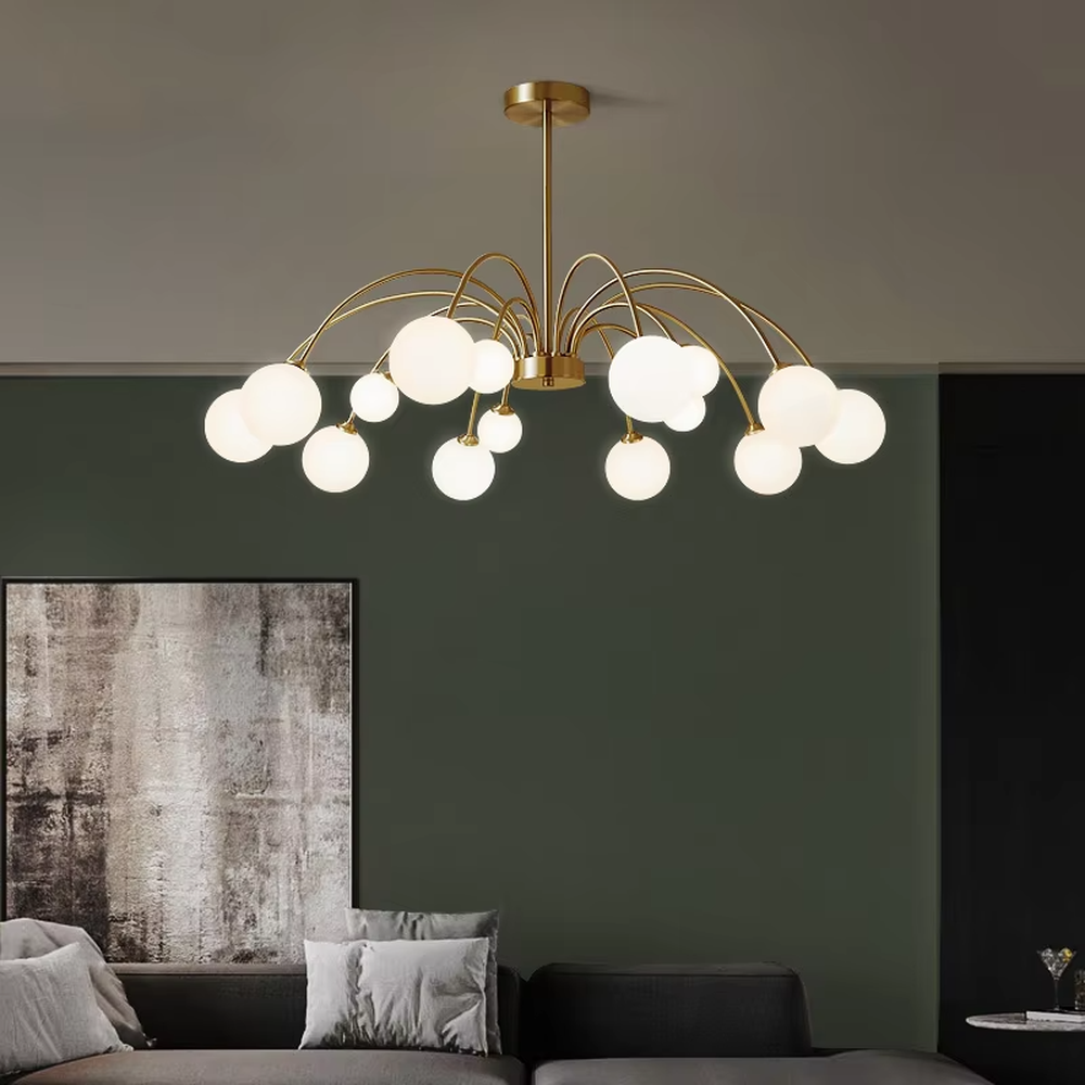 A modern light luxury style firefly chandelier, featuring a gold metal curved branch frame paired with multiple milky white glass glowing spheres of varying sizes, shaped like a blooming dandelion or flying fireflies. It emits a soft and uniform glow when lit, combining decorative appeal with practical illumination, ideal for creating a romantic and dynamic space atmosphere.