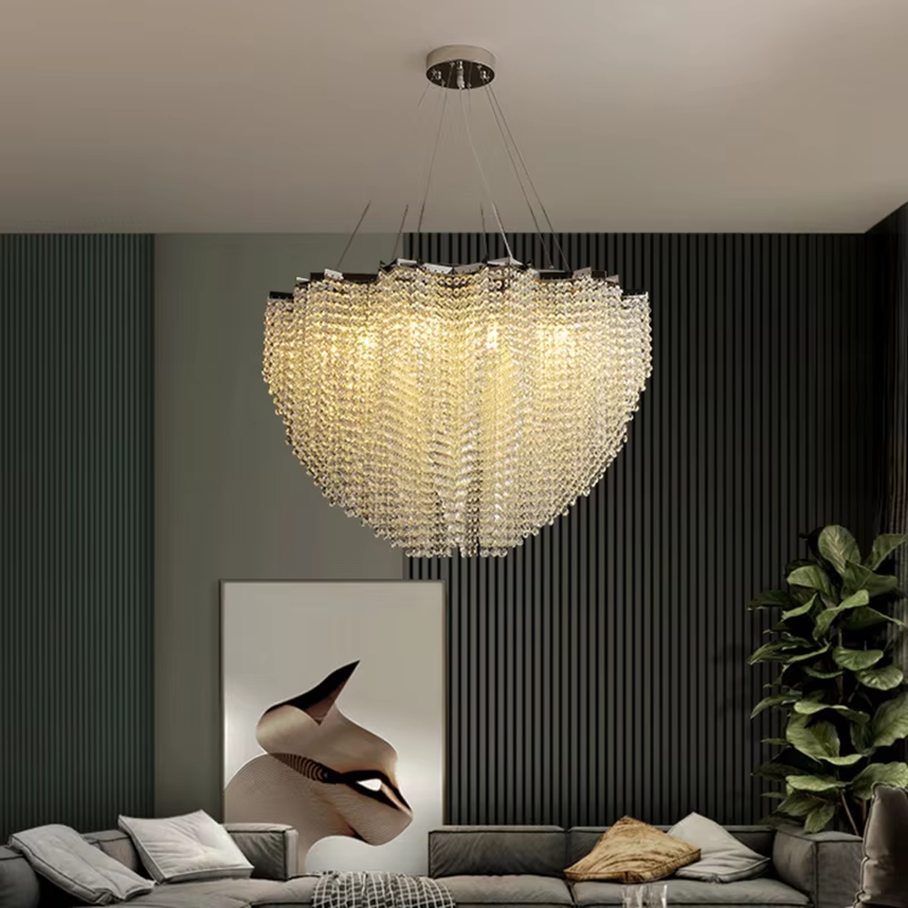 This light luxury heart-shaped crystal chandelier features a full heart shape made of crystal beads, with warm light refracting a brilliant halo through the crystals, serving both lighting and decorative purposes, suitable for modern light luxury spaces such as living rooms and dining rooms.