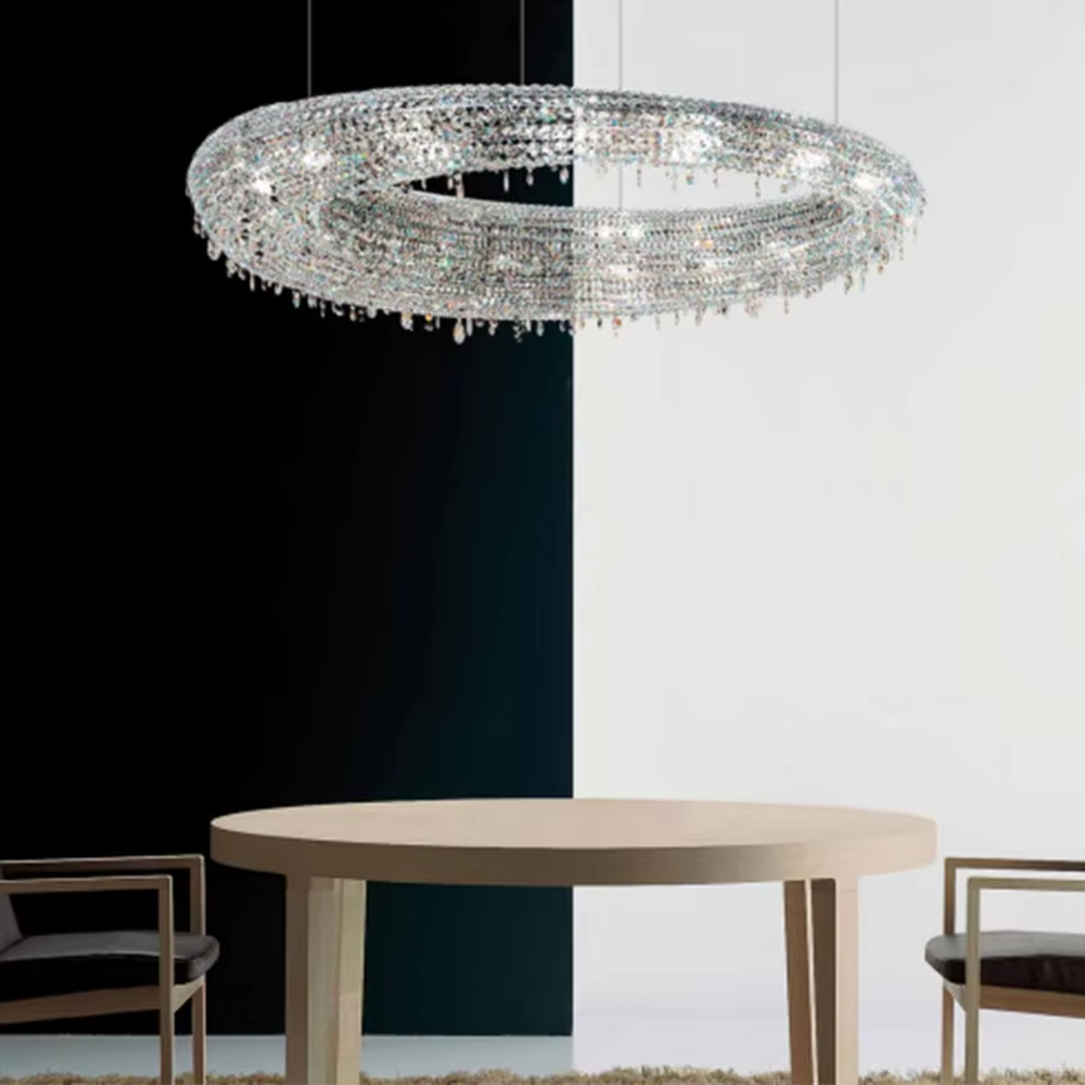 Modern art double-ring streamlined crystal chandelier, with dense crystal particles forming a flowing cloud pattern with staggered double rings, emitting brilliant and transparent light, combining artistic decorativeness and lighting function, suitable for core lighting and atmosphere creation in large spaces such as high-ceiling living rooms, villa hollow areas, and high-end clubs.