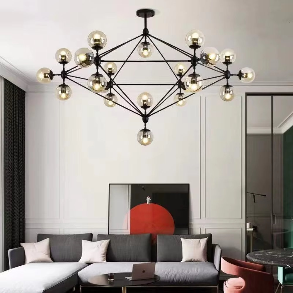 An industrial and modern minimalist combined molecular structure chandelier, featuring a cubic geometric frame made of black iron, paired with amber glass ball bulbs. It emits a warm and soft glow when lit, combining decorative appeal with practical illumination, ideal for creating a bold and avant-garde space atmosphere.