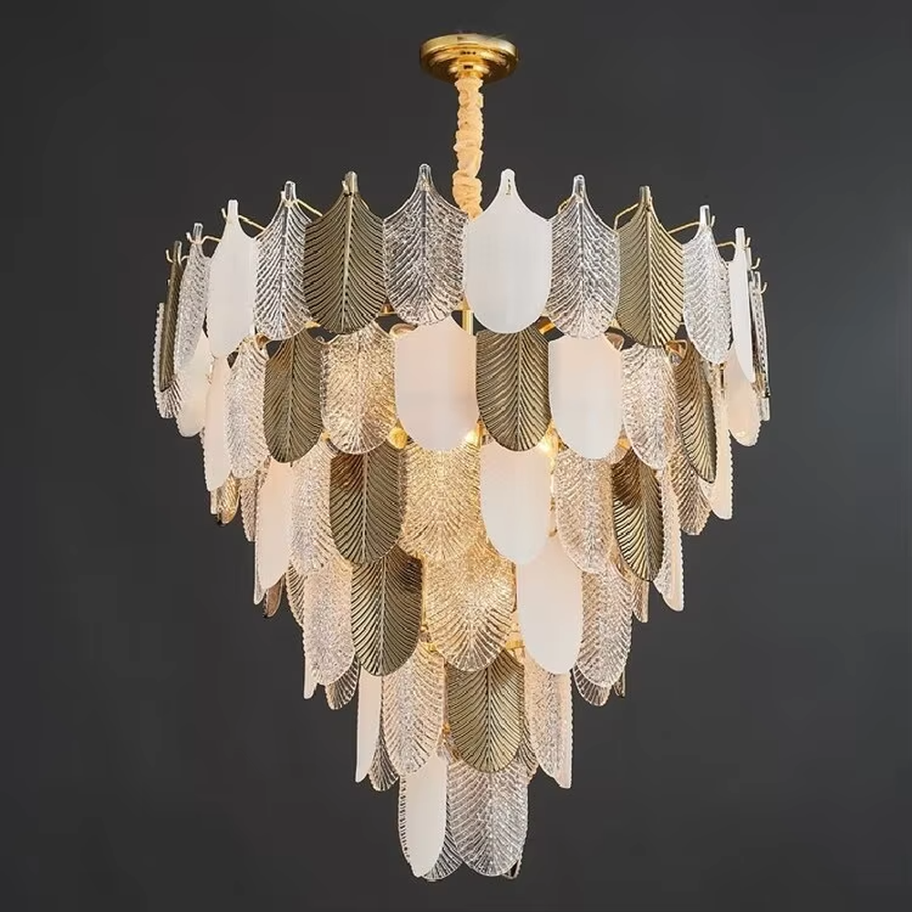 This modern light luxury leaf art chandelier is composed of gold and transparent leaf-shaped ornaments arranged in staggered layers, presenting a light and elegant shape like spreading feathers. Light refracts through the ornaments to emit a soft and transparent halo, serving both lighting and decorative purposes, suitable for modern light luxury style spaces such as living rooms and dining rooms.
