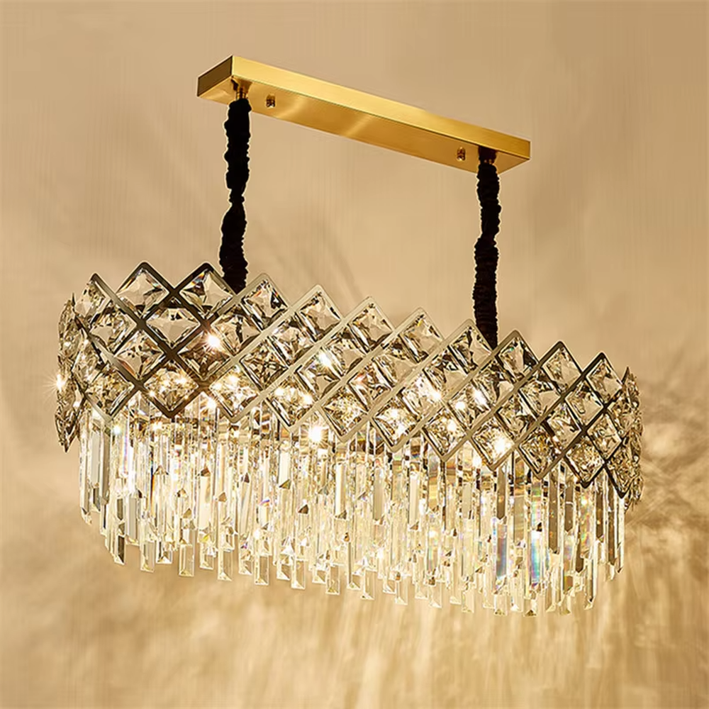 This light luxury rectangular crystal chandelier features a metal frame paired with a rhombus-faceted crystal border and drooping crystal tassels, with light refracting a brilliant halo through the crystals, serving both lighting and decorative purposes, suitable for modern light luxury spaces such as dining rooms and living rooms.