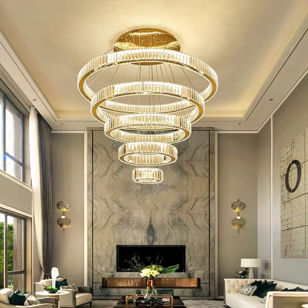 A modern light luxury three-tier interlocking ring crystal chandelier, featuring a gold metal frame inlaid with high-transparency crystal strips. Its interlocking ring structure resembles cosmic orbits, emitting a brilliant yet soft glow when lit, combining decorative appeal with practical illumination, ideal for creating a high-end and sophisticated space atmosphere.