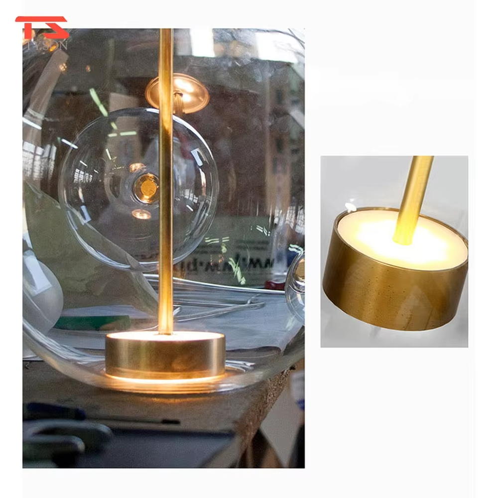 A modern light luxury style bubble-shaped chandelier, suspended by gold wires, paired with transparent glass bubble lampshades of varying sizes. It emits a soft and transparent glow when lit, combining decorative appeal with practical illumination, ideal for creating a dreamy and light space atmosphere.