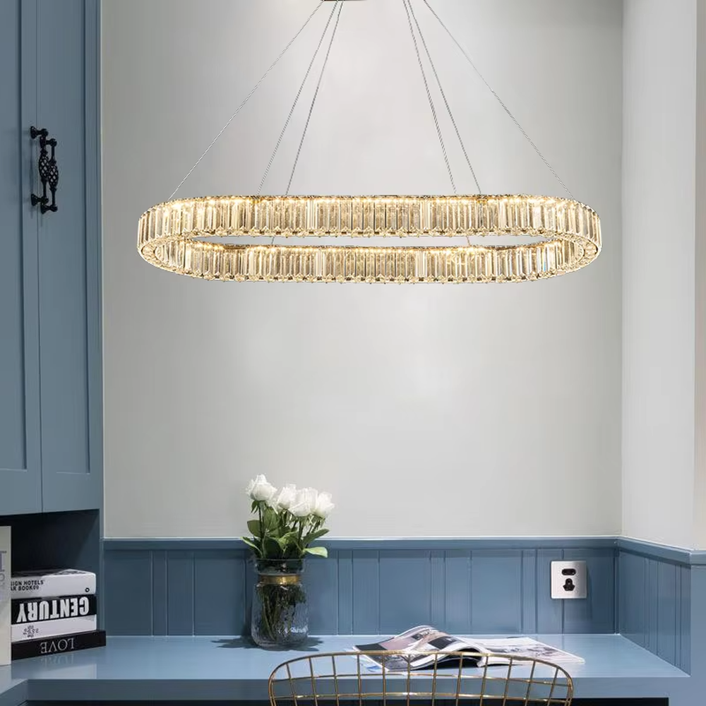 This is a light luxury double-layer spiral ring crystal chandelier, with a gold metal frame inlaid with high-transparency crystal strips, presenting a dynamic staggered ring structure, with brilliant and soft light, both decorative and lighting functions, ideal for high-end indoor spaces such as living rooms and dining rooms.
