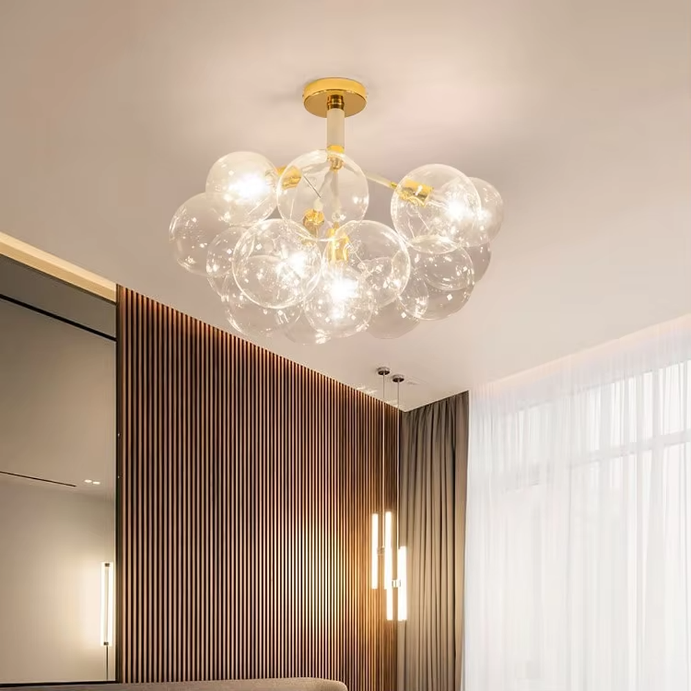 Modern light luxury bubble glass semi-flush mount ceiling light, with a golden base paired with transparent glass ball lampshades stacked into a cloud shape, featuring transparent and soft light, combining decorative and lighting functions, suitable for living rooms, bedrooms and other modern style spaces.
