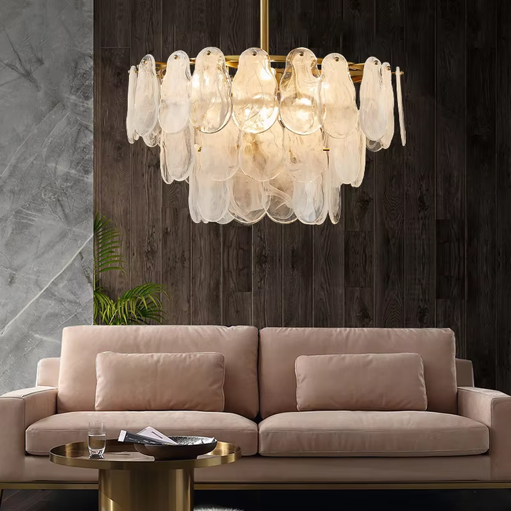 A modern light luxury style ring chandelier, featuring a gold metal frame with layered gradient glass petal panels. It emits a soft and warm glow when lit, combining decorative appeal with practical illumination, ideal for creating an elegant and sophisticated space atmosphere.