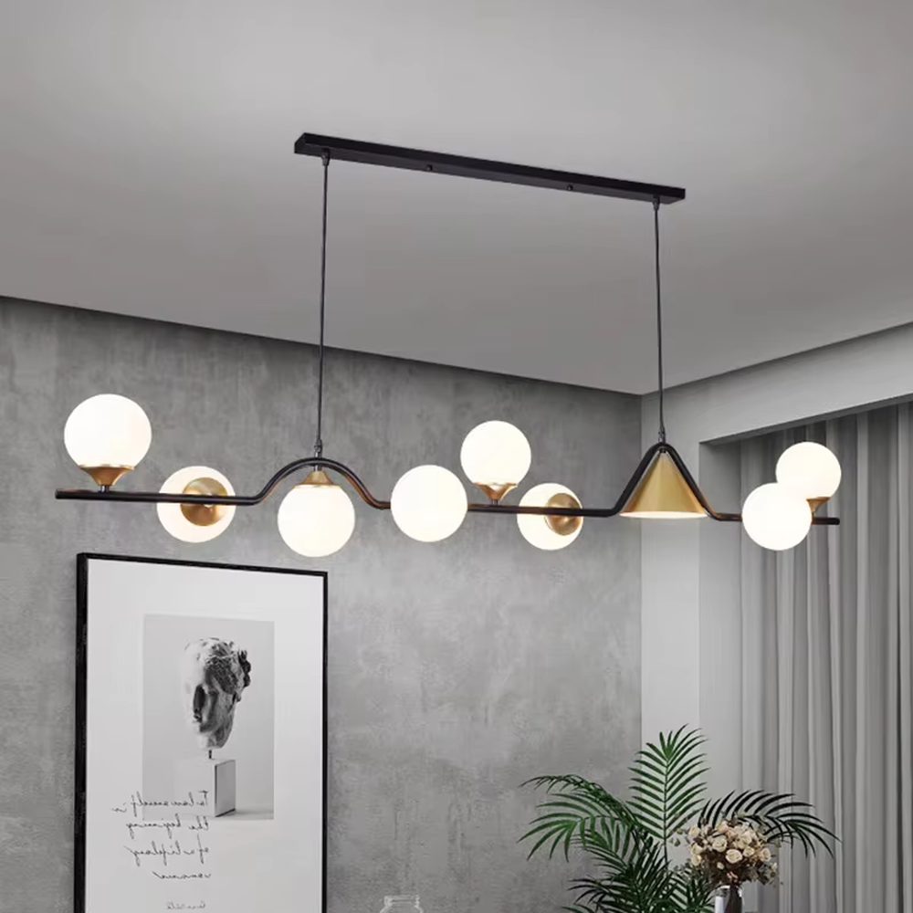 Modern light luxury black-gold contrasting dining chandelier, with a long black metal frame paired with a golden conical lampshade and transparent glass ball lampshades, featuring a minimalist and flexible shape, combining decorative and lighting functions, suitable for dining rooms, bars and other modern style spaces.