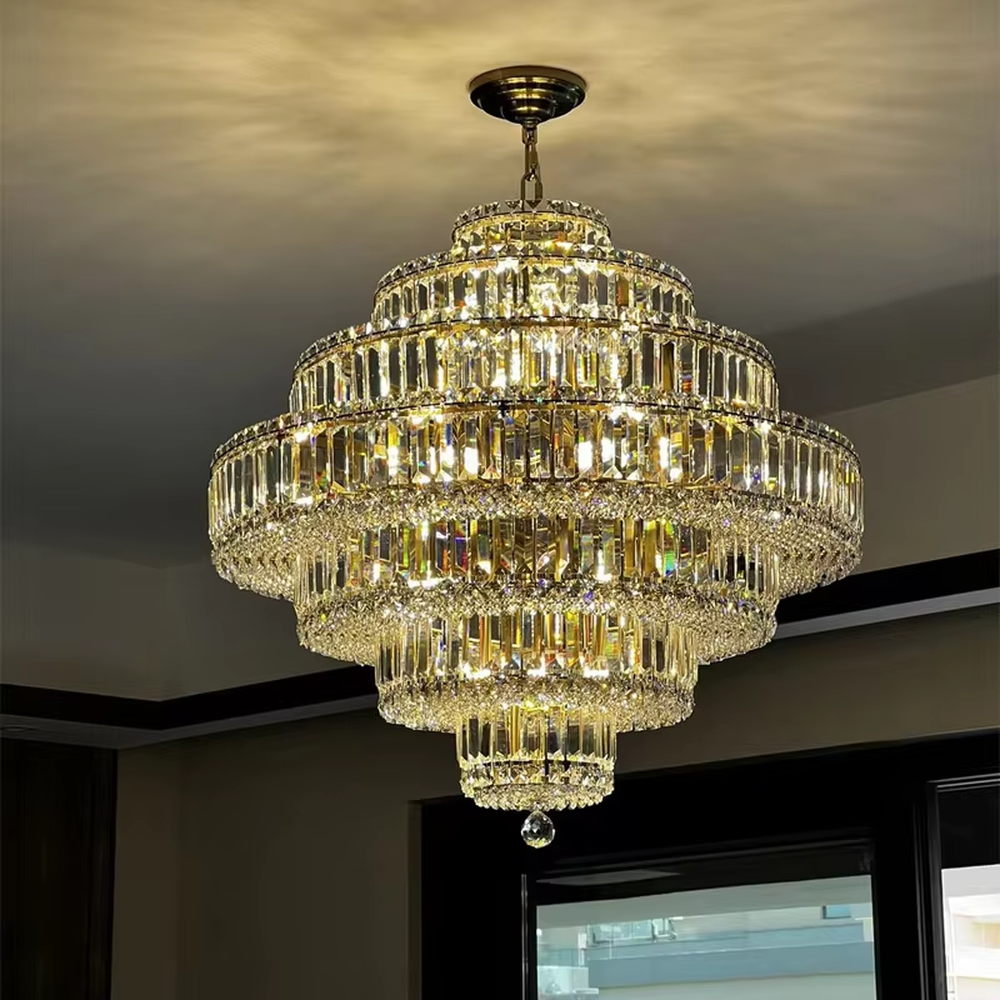 This is a luxurious multi-layer pagoda-shaped crystal chandelier, supported by a gold metal frame with high-transparency crystal strips, creating a brilliant and dazzling light effect through staggered layers, with both decorative and lighting functions, ideal for high-end indoor spaces such as villa living rooms and hotel lobbies.