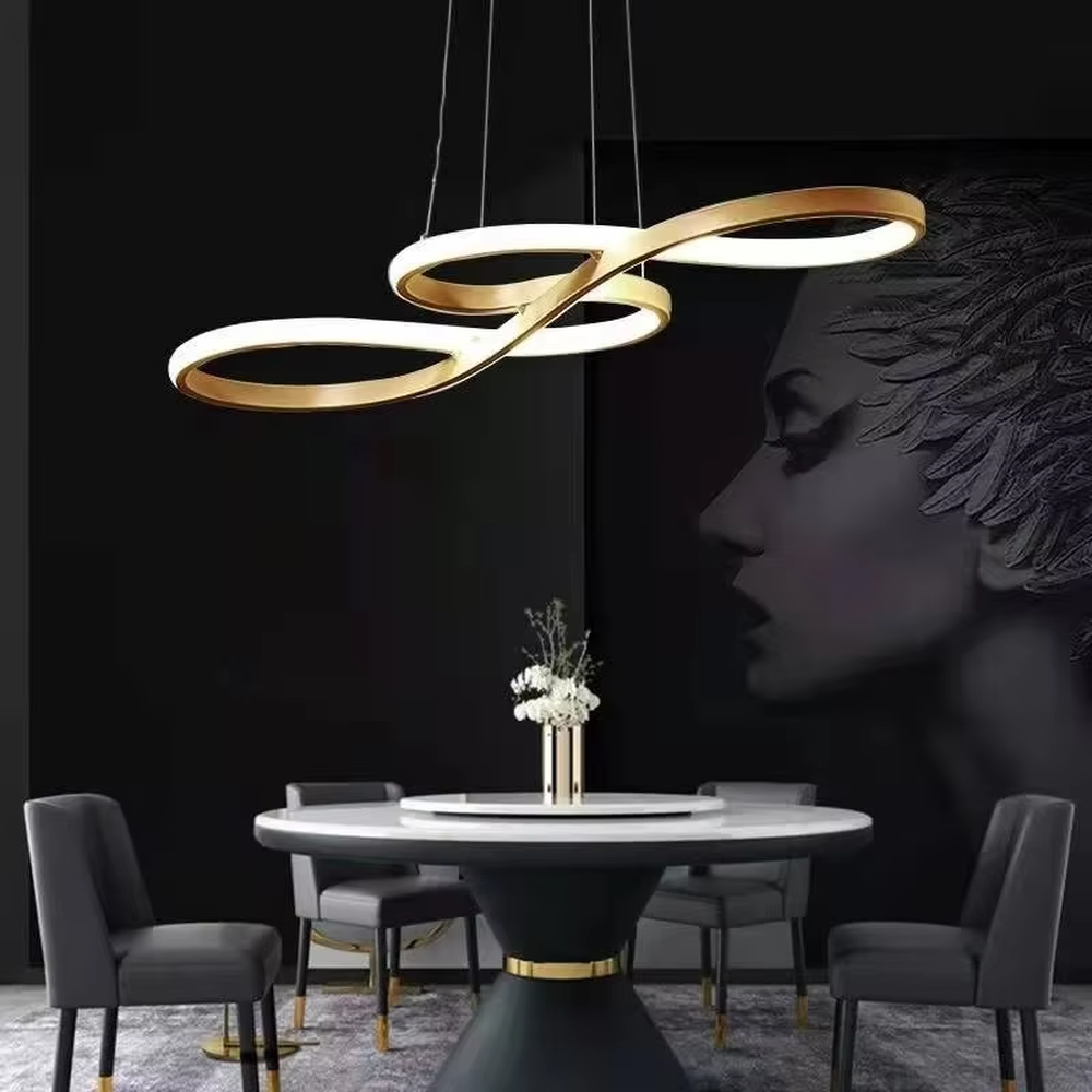 A modern light luxury style double-loop interwoven LED chandelier, featuring a smooth interwoven ring frame made of gold metal, with built-in high-brightness LED strips. It emits a soft and uniform glow when lit, combining decorative appeal with practical illumination, ideal for creating a minimalist and sophisticated space atmosphere.