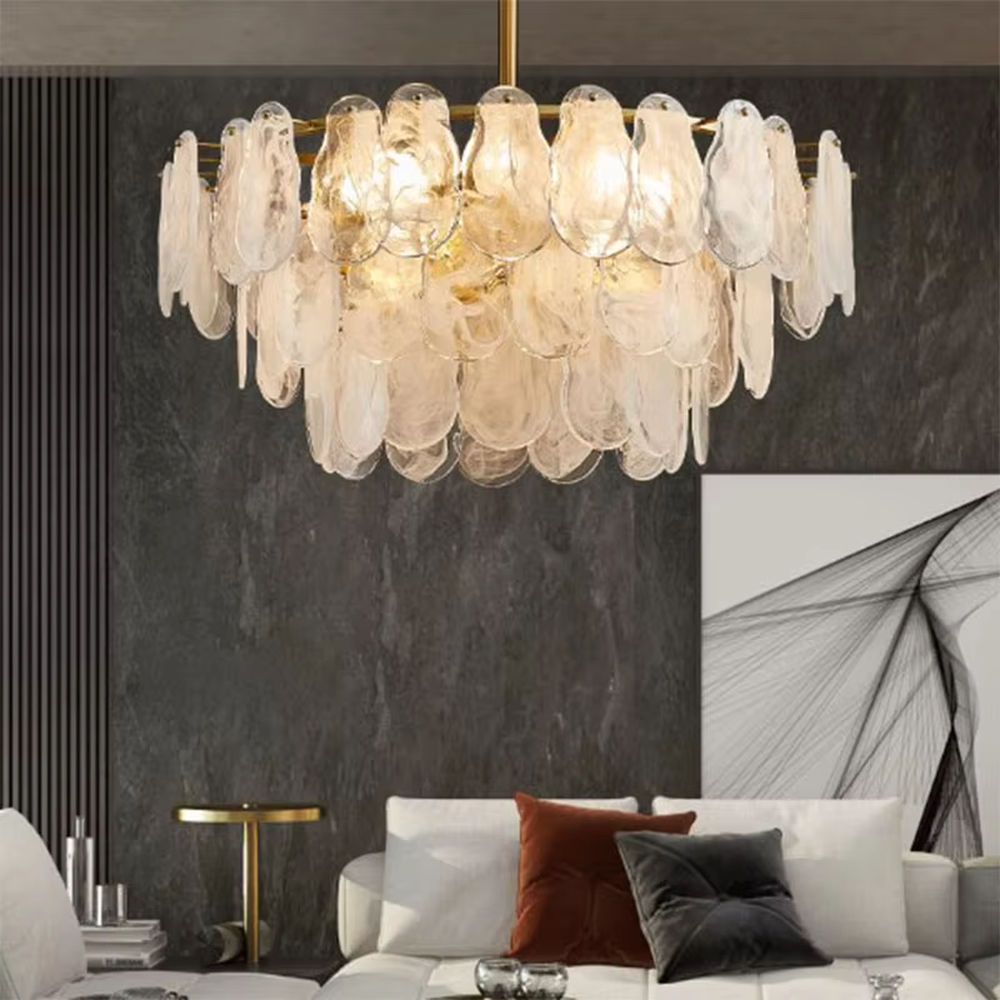 A modern light luxury style ring chandelier, featuring a gold metal frame with layered gradient glass petal panels. It emits a soft and warm glow when lit, combining decorative appeal with practical illumination, ideal for creating an elegant and sophisticated space atmosphere.