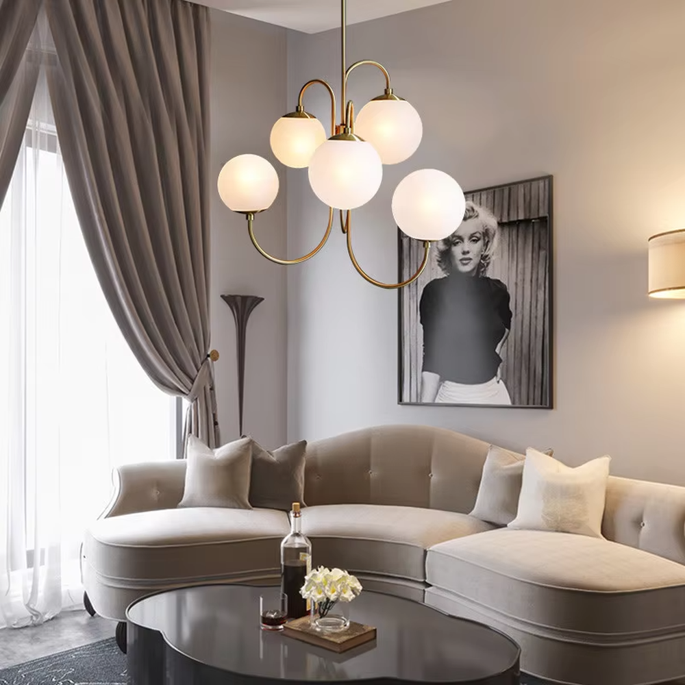 This light luxury golden cloud bubble chandelier features a gold curved metal frame paired with multiple white spherical frosted lampshades, with soft and uniform light, serving both lighting and decorative purposes, suitable for modern light luxury spaces such as living rooms and dining rooms.