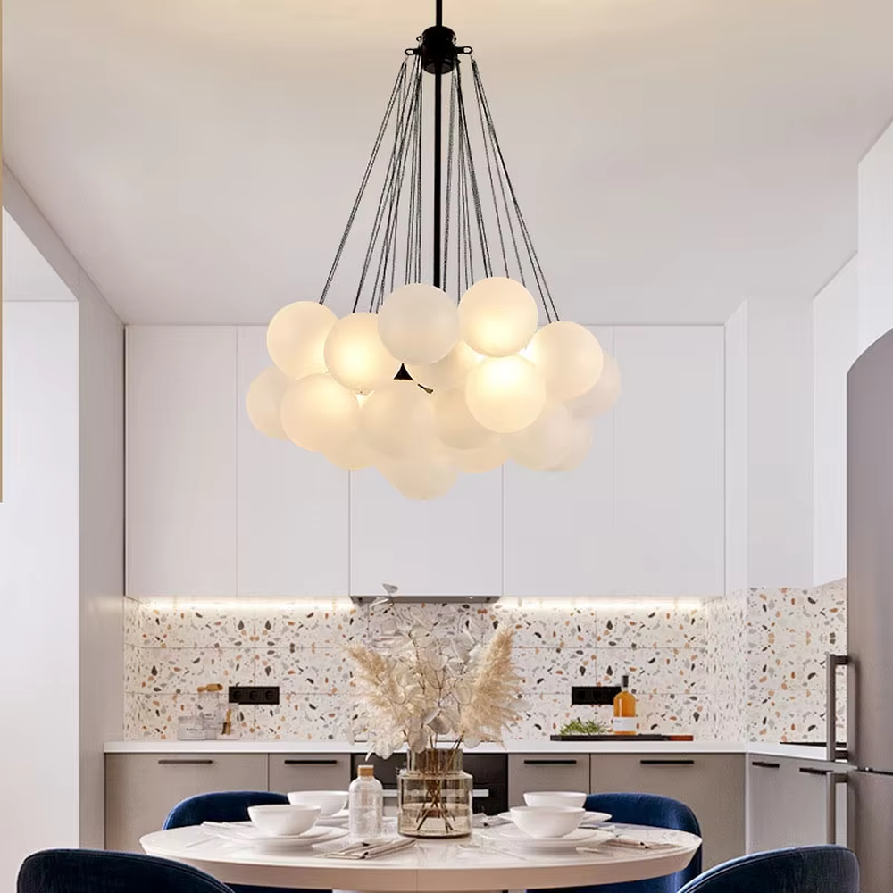 Modern light luxury cloud-shaped chandelier, with a golden metal frame and milky white glass ball lampshades stacked into a full cloud shape, featuring soft and warm light, combining decorative and lighting functions, suitable for living rooms, dining rooms, bedrooms and other modern style spaces.