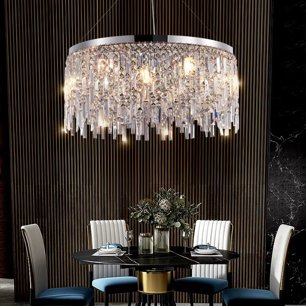 This light luxury tassel crystal chandelier features a circular tassel shape made of a metal frame and multi-layer faceted crystal strips, with light refracting a brilliant halo through the crystals, serving both lighting and decorative purposes, suitable for modern light luxury spaces such as living rooms and dining rooms.