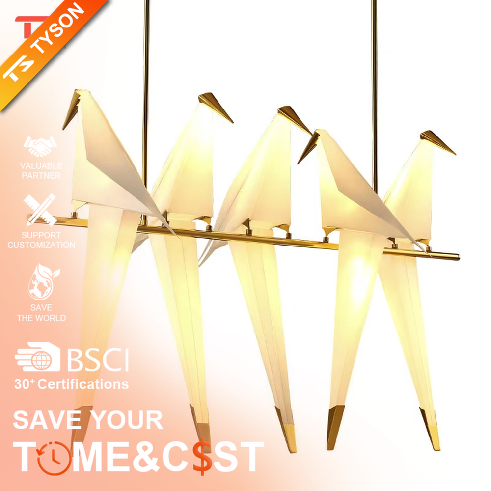 A modern art light luxury style origami crane chandelier, featuring a gold metal ring frame paired with an origami-style white translucent lampshade, shaped like an origami crane perched in a gold ring. It emits a soft and warm glow when lit, combining decorative appeal with practical illumination, ideal for creating an elegant and soothing space atmosphere.