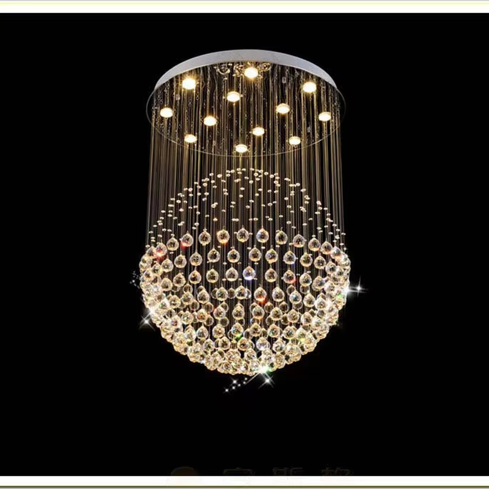 This light luxury crystal ball pendant chandelier features a circular metal base paired with metal wires and dense crystal balls, forming a full spherical shape, with dazzling light, serving both lighting and decorative purposes, suitable for high-end residential spaces such as high-ceiling living rooms and villas.