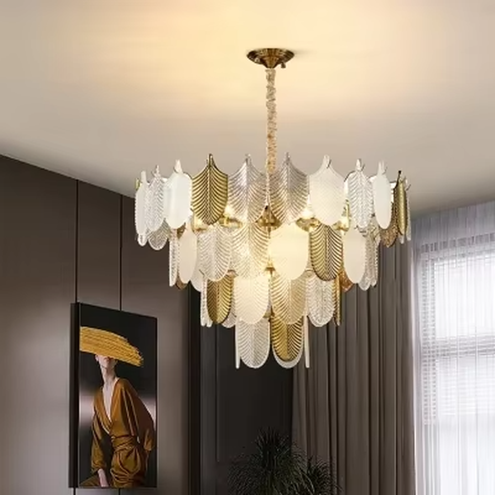 This modern light luxury leaf chandelier is composed of staggered layers of gold and transparent leaf-shaped ornaments, presenting a light shape like spreading feathers. Light refracts through the ornaments to emit a soft and transparent halo, serving both lighting and decorative purposes, suitable for modern light luxury spaces such as living rooms and dining rooms.