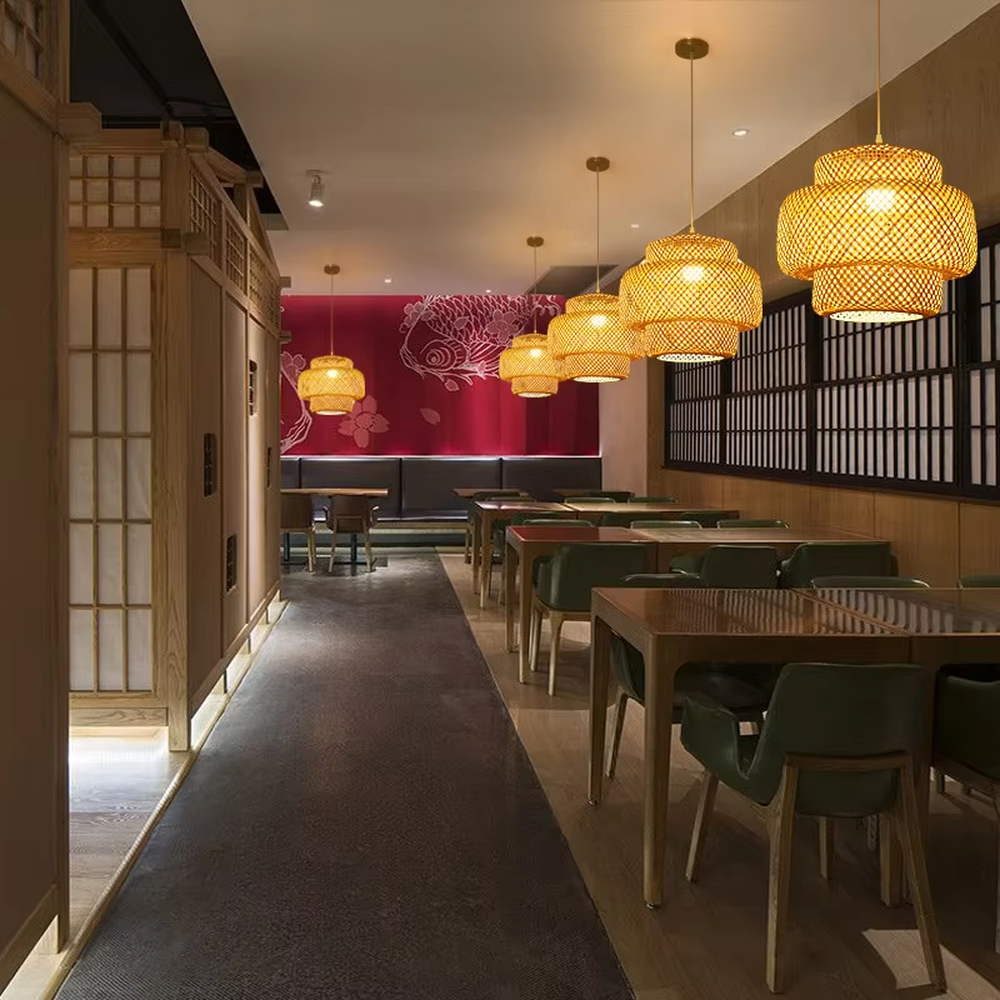 This new Chinese-style bamboo woven lantern chandelier is made of natural bamboo strips woven into a multi-layer hollow lantern shape. Warm light refracts through the bamboo texture to emit a soft halo, serving both lighting and decorative purposes, suitable for Chinese restaurants, homestays, cafes and other spaces.