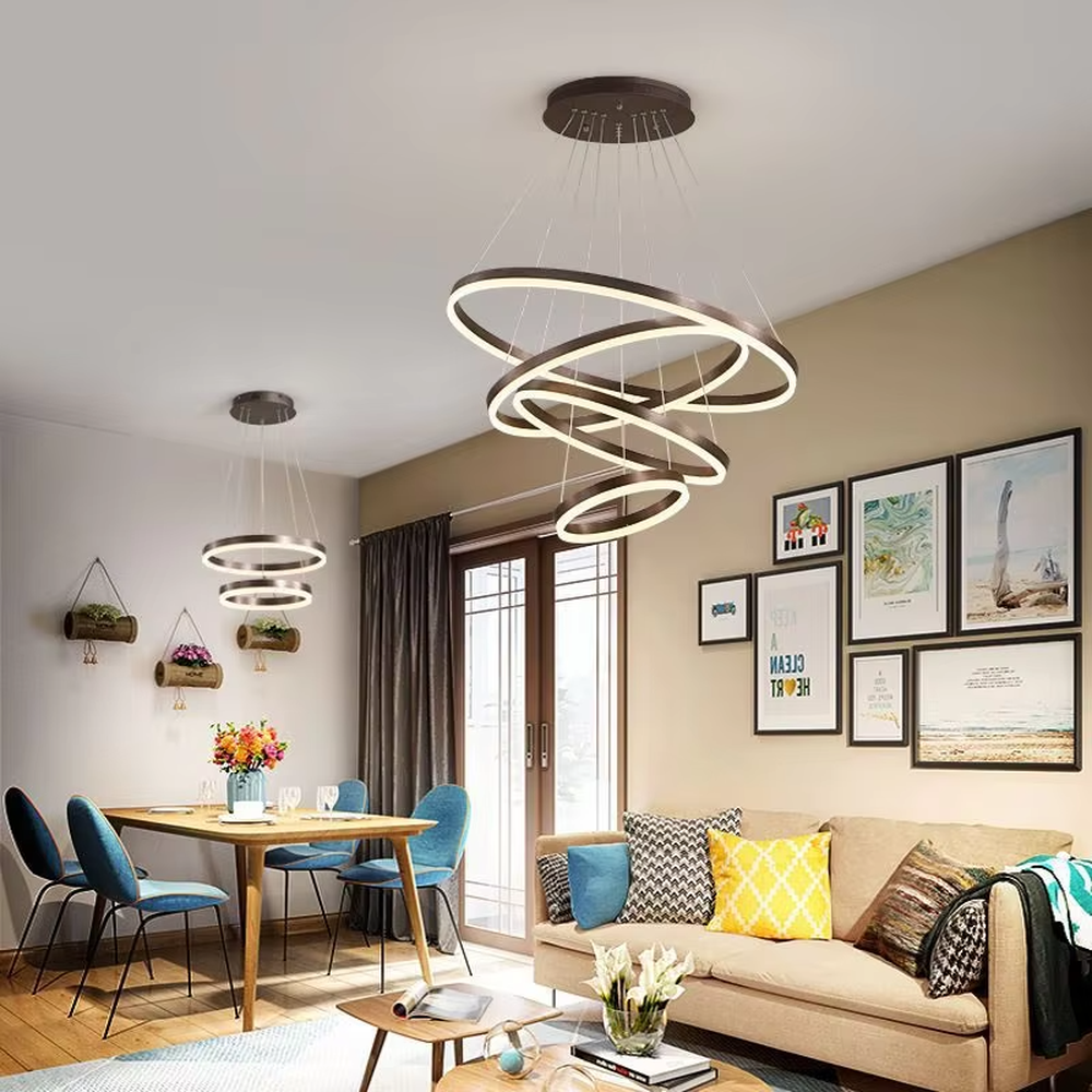 A modern light luxury three-tier ring LED chandelier, featuring a gold metal frame with built-in soft light strips and adjustable suspension rods for different ceiling heights, combining lighting and decorative functions, ideal for creating a minimalist and sophisticated space atmosphere.