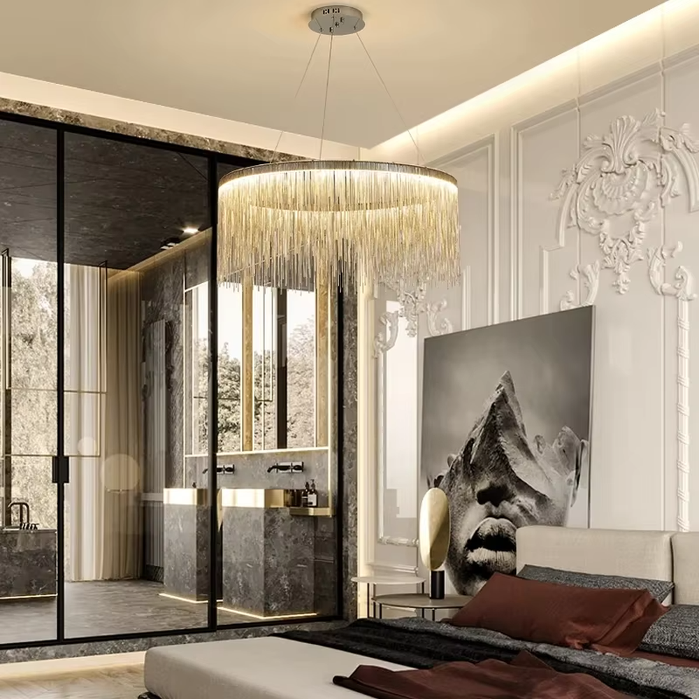 Light luxury metal tassel chandelier, crafted with copper-gold metal strips to create a cascading tassel shape. Light passes through the metal strips to produce a warm, layered lighting effect, making it a high-end decorative lighting fixture that combines artistry and ambiance.