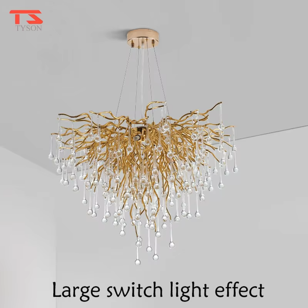 This light luxury golden branch crystal rain linear chandelier features a bionic branch structure made of gold metal, paired with crystal water drop pendants, with brilliant and soft light, serving both lighting and decorative purposes, suitable for modern light luxury spaces such as dining rooms and living rooms.