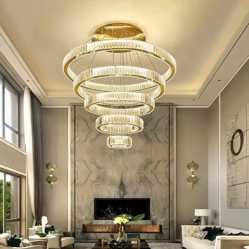 This modern light luxury multi-layer interlaced ring crystal chandelier features a gold metal frame paired with a high-transparency crystal lamp body. The multi-layer rings are staggered and interwoven to present a dynamic interstellar shape. The light refracts through the crystal to emit a brilliant and soft glow, serving both lighting and decorative purposes, suitable for modern light luxury style spaces such as living rooms and dining rooms.