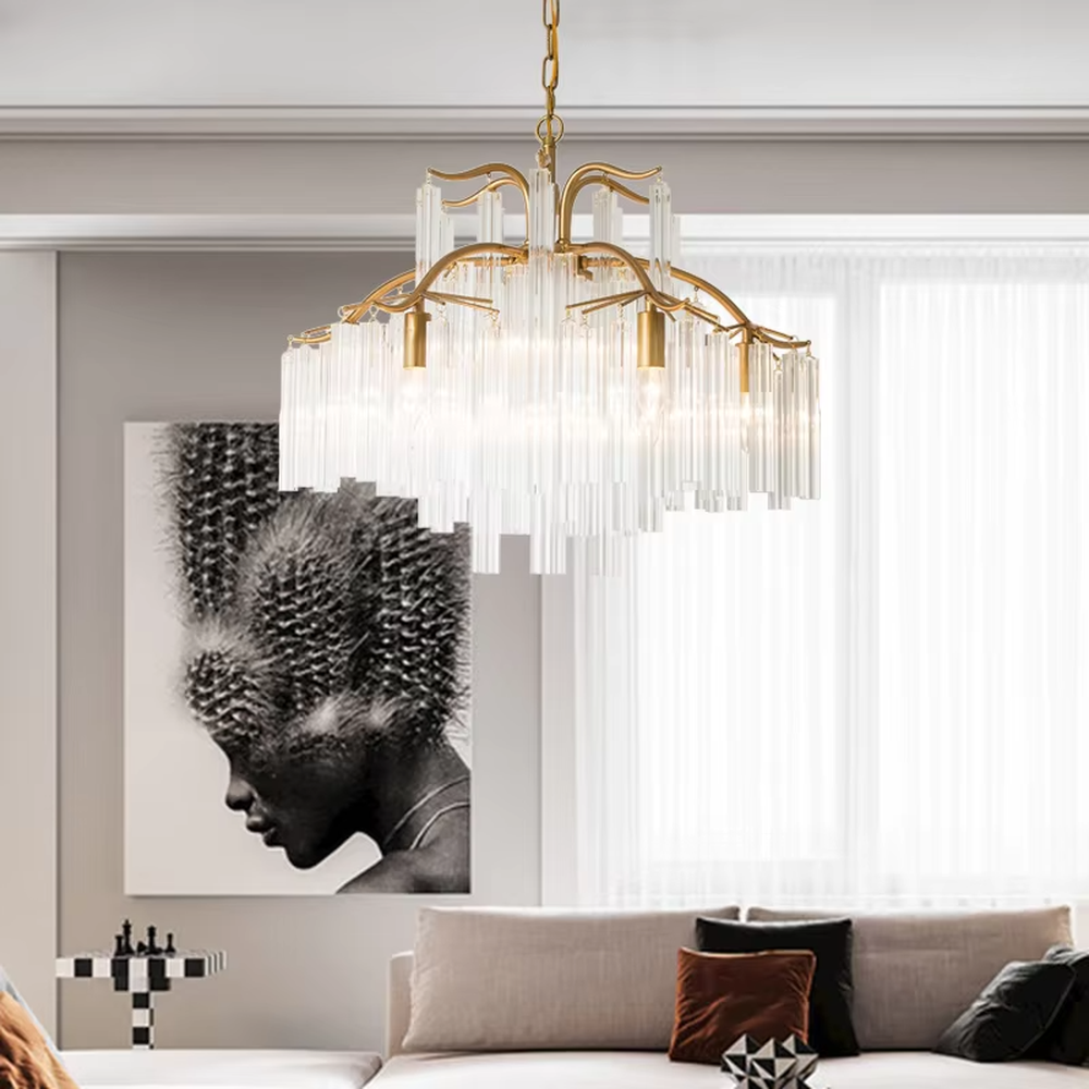 This light luxury golden branch cloud waterfall chandelier features a cloud shape made of golden branch-like metal frames and transparent crystal strips, with light refracting a soft halo through the crystals, serving both lighting and decorative purposes, suitable for modern light luxury spaces such as living rooms and dining rooms.