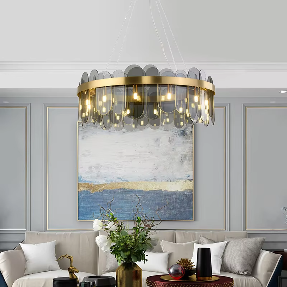A modern light luxury style ring chandelier, featuring a gold metal frame paired with gradient transparent circular glass panels. It emits a soft and brilliant glow when lit, combining decorative appeal with practical illumination, ideal for creating an elegant and sophisticated space atmosphere.