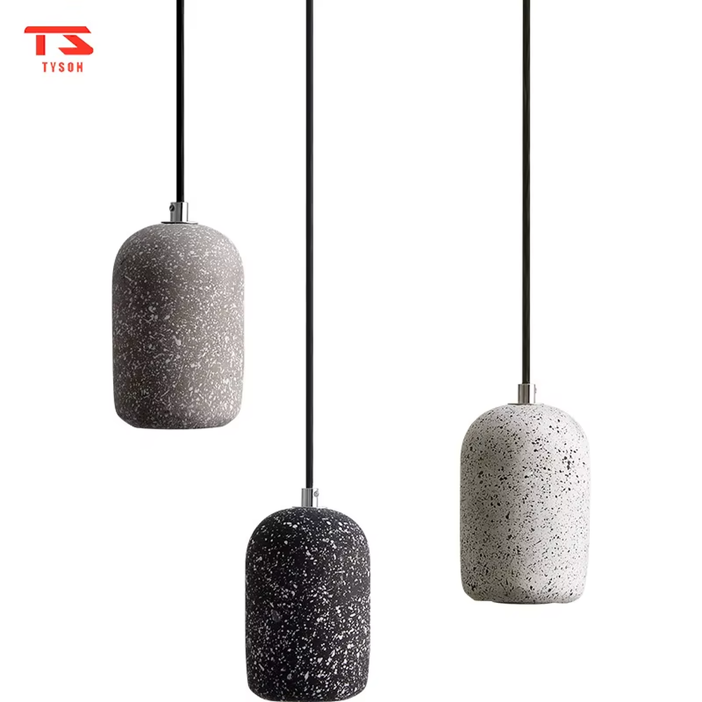Modern industrial style terrazzo texture single-head chandelier, available in three colors (white, brown, black), with a cylindrical particle-textured lamp body that emits soft, focused light. It combines decorativeness and practicality, suitable for ambient and supplementary lighting in restaurant bars, bedroom nightstands, industrial-style shops, etc.