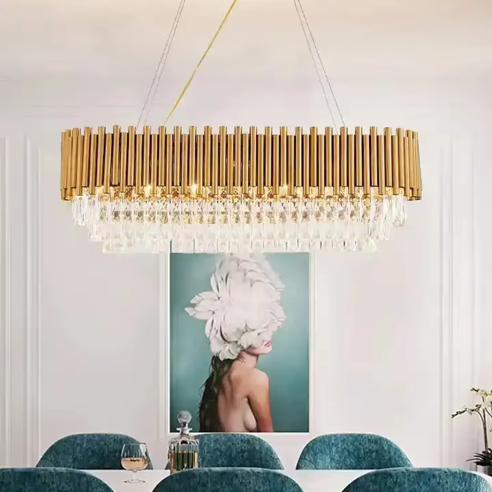This is a light luxury and luxurious style multi-layer crystal chandelier, with a gold metal top paired with a transparent crystal column pendant structure, which has both lighting and decorative functions, suitable for high-end spaces such as villa high-ceiling living rooms, duplex stairwells, and hotel lobbies.