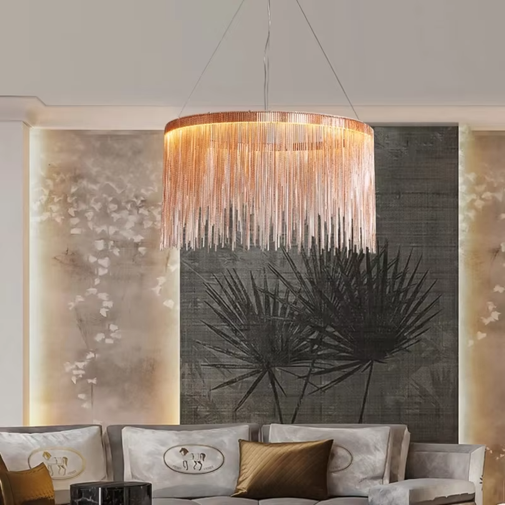 Light luxury metal tassel chandelier, crafted with copper-gold metal strips to create a cascading tassel shape. Light passes through the metal strips to produce a warm, layered lighting effect, making it a high-end decorative lighting fixture that combines artistry and ambiance.