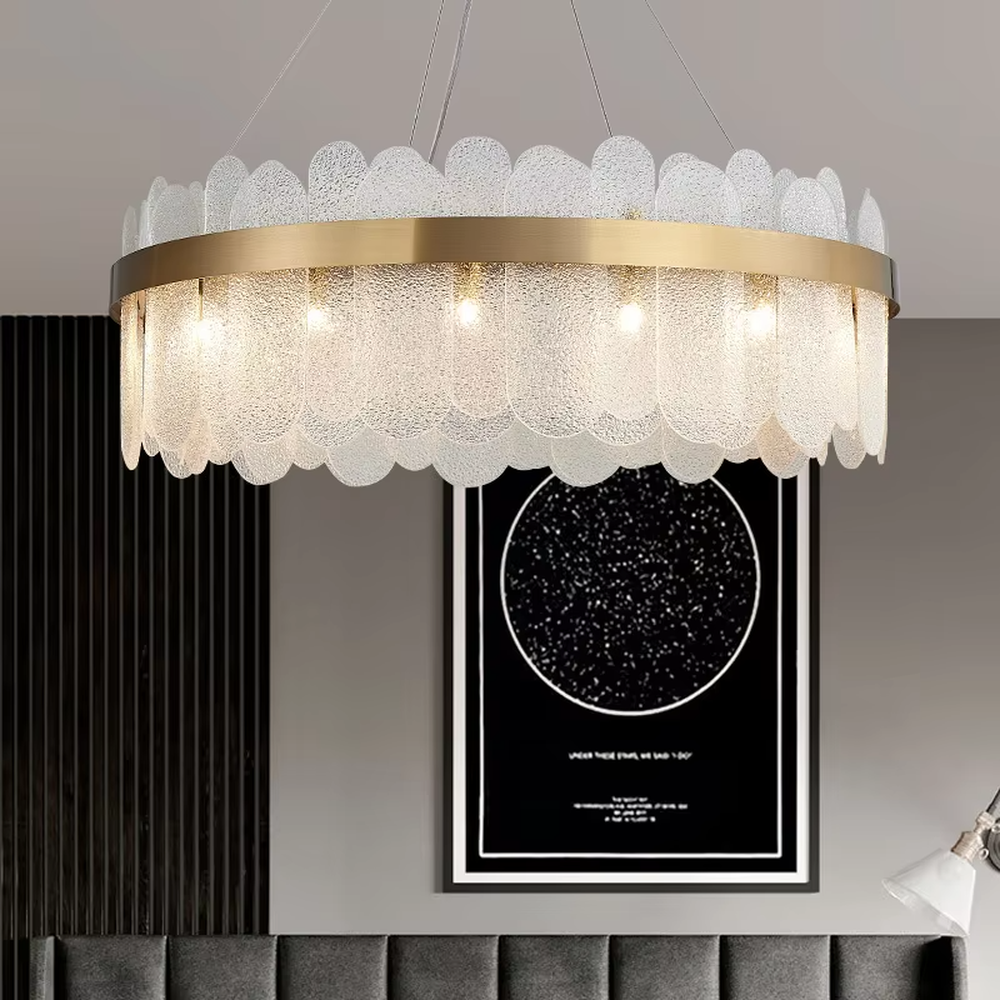 A modern light luxury style ring chandelier, featuring a gold metal frame paired with gradient transparent circular glass panels. It emits a soft and brilliant glow when lit, combining decorative appeal with practical illumination, ideal for creating an elegant and sophisticated space atmosphere.