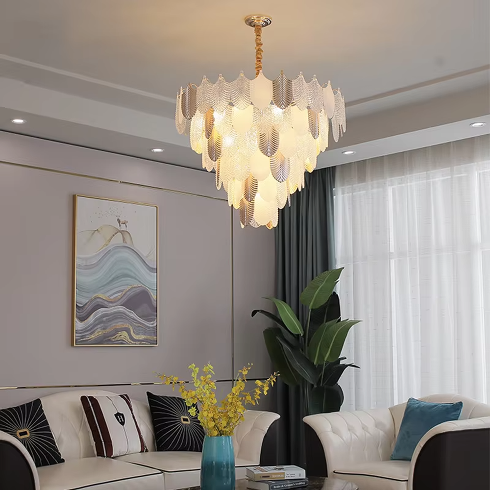 This light luxury leaf crystal chandelier features a gold metal frame paired with leaf-shaped liuli ornaments and drooping crystal tassels, with light refracting a brilliant halo through the crystals, serving both lighting and decorative purposes, suitable for modern light luxury spaces such as living rooms and dining rooms.