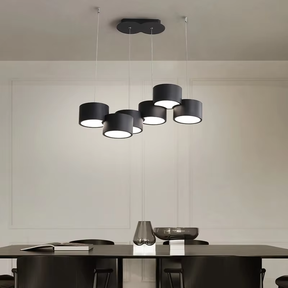 A modern minimalist multi-head cylindrical chandelier, featuring a white metal housing with a staggered stacked layout, built-in LED light source. It emits soft and uniform warm light when lit, combining decorative appeal with practical illumination, ideal for creating a minimalist and fresh space atmosphere.