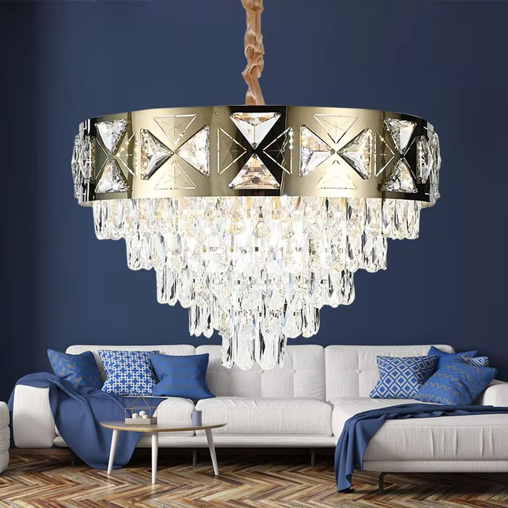 This is a luxurious round crystal chandelier, with a gold metal frame inlaid with cut crystal decorations, and cascading crystal strips hanging below, featuring brilliant and soft light, both decorative and lighting functions, ideal for high-end indoor spaces such as living rooms and dining rooms.