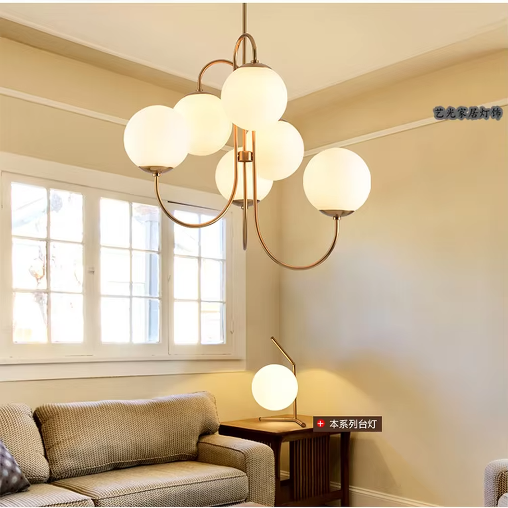 This light luxury golden cloud bubble chandelier features a gold curved metal frame paired with multiple white spherical frosted lampshades, with soft and uniform light, serving both lighting and decorative purposes, suitable for modern light luxury spaces such as living rooms and dining rooms.