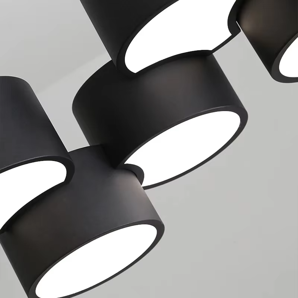 A modern minimalist multi-head cylindrical chandelier, featuring a white metal housing with a staggered stacked layout, built-in LED light source. It emits soft and uniform warm light when lit, combining decorative appeal with practical illumination, ideal for creating a minimalist and fresh space atmosphere.