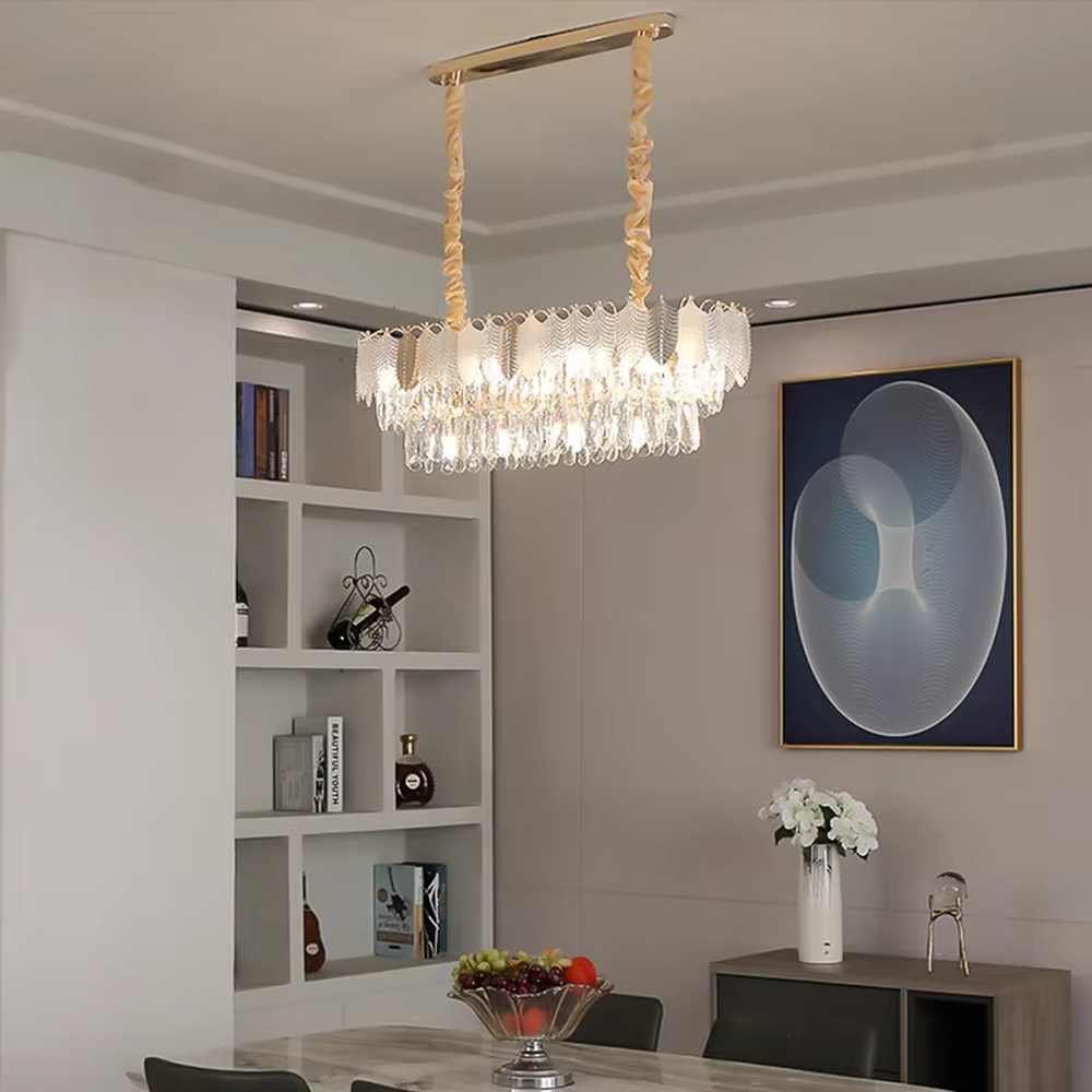 This light luxury leaf crystal chandelier features a gold metal frame paired with leaf-shaped liuli ornaments and drooping crystal tassels, with light refracting a brilliant halo through the crystals, serving both lighting and decorative purposes, suitable for modern light luxury spaces such as living rooms and dining rooms.