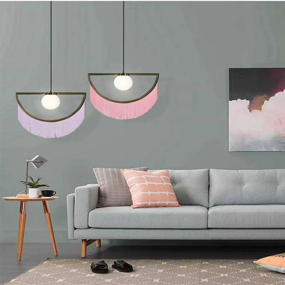 Modern minimalist semicircular tassel pendant lamp, with black-gold/pink-gold metal semicircular frames paired with semi-transparent lampshades, cascading same-color tassel decorations, built-in spherical light sources, emitting soft and warm light, combining decorativeness and lighting function, suitable for accent lighting and atmosphere creation in spaces such as bedroom nightstands, restaurant bars, and children's rooms.
