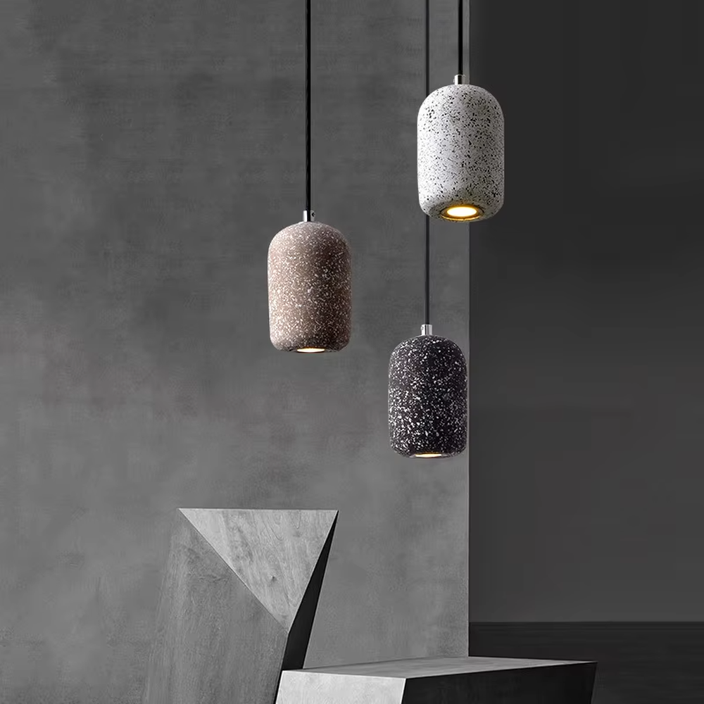 Modern industrial style terrazzo texture single-head chandelier, available in three colors (white, brown, black), with a cylindrical particle-textured lamp body that emits soft, focused light. It combines decorativeness and practicality, suitable for ambient and supplementary lighting in restaurant bars, bedroom nightstands, industrial-style shops, etc.
