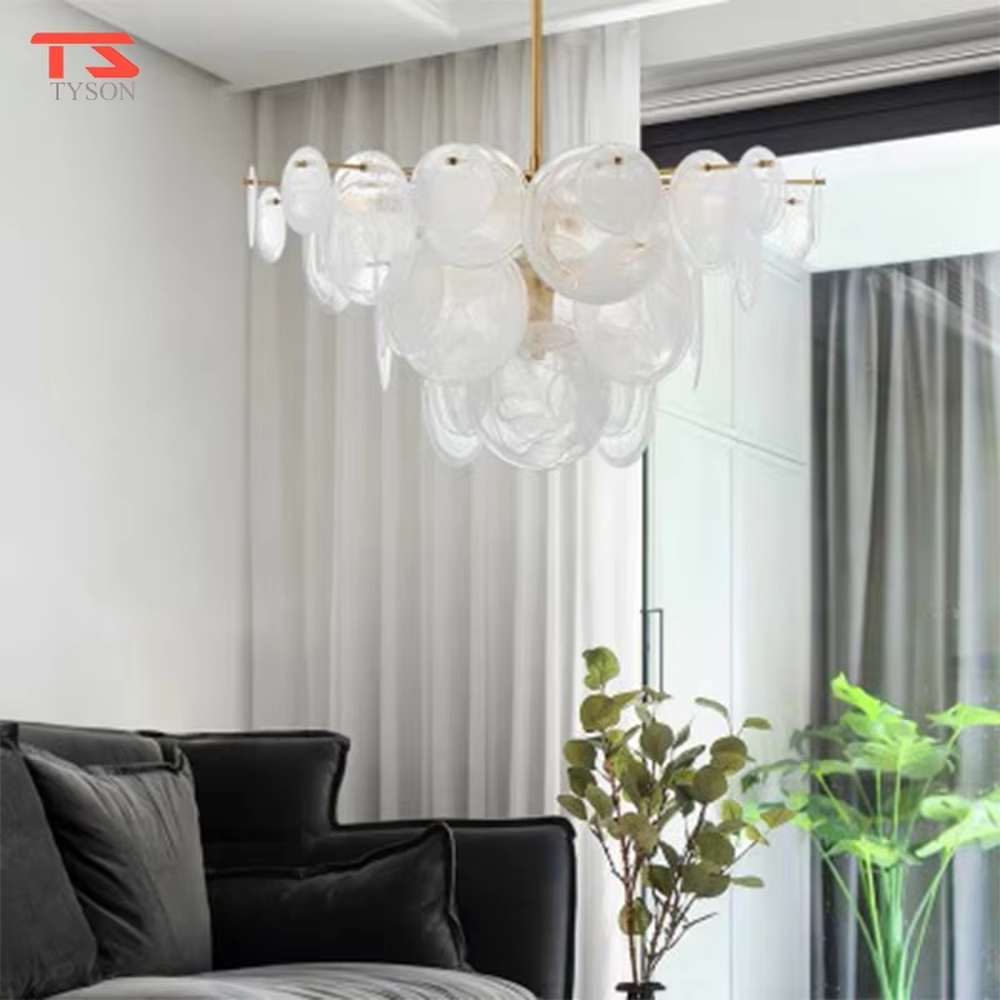 French light luxury glass cloud chandelier, with a golden metal frame paired with transparent glass sheets stacked into a fluffy cloud shape, featuring soft and transparent light, combining decorative and lighting functions, suitable for bedrooms, living rooms, light luxury style spaces.