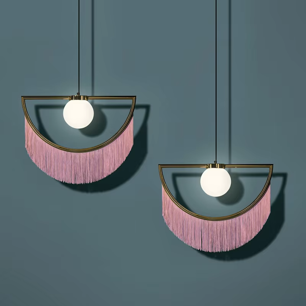 Modern minimalist semicircular tassel pendant lamp, with black-gold/pink-gold metal semicircular frames paired with semi-transparent lampshades, cascading same-color tassel decorations, built-in spherical light sources, emitting soft and warm light, combining decorativeness and lighting function, suitable for accent lighting and atmosphere creation in spaces such as bedroom nightstands, restaurant bars, and children's rooms.