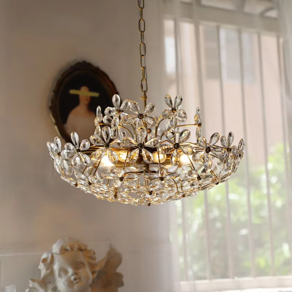 A French light luxury style double-layer crystal petal chandelier, featuring a gold iron frame inlaid with K9 crystal petal decorations. It emits a brilliant and soft glow when lit, combining decorative appeal with practical illumination, ideal for creating a romantic and retro space atmosphere.